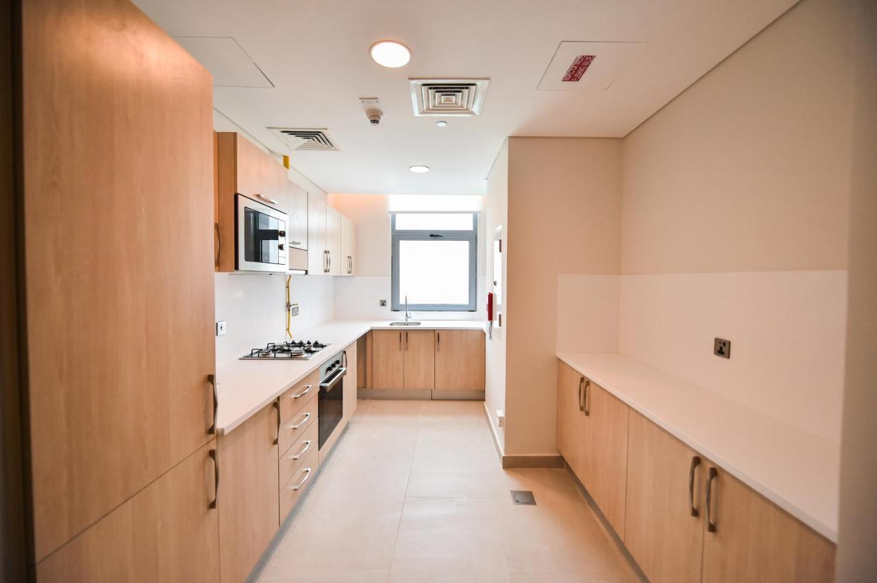Waterfront Hotel Apartment Lusail Exteriér fotografie A typical kitchen in a student flat